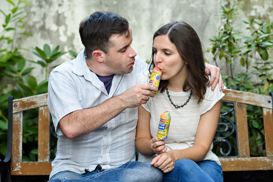 A man shares his ice cream with his fiance in their fishtown engagement session.